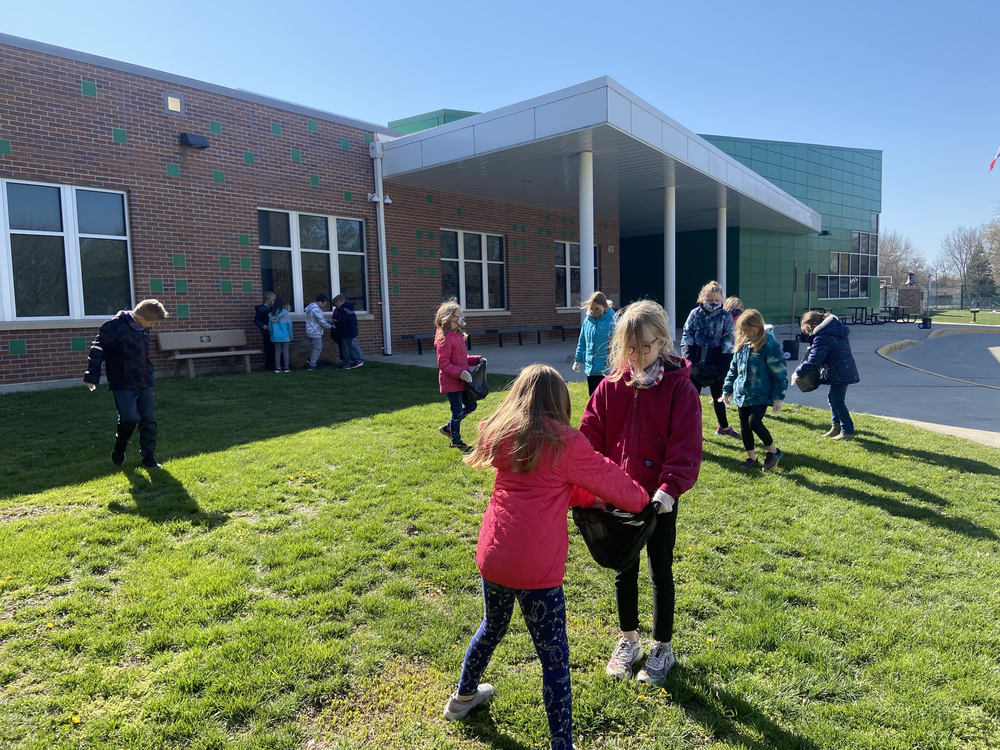 students picking up garbage