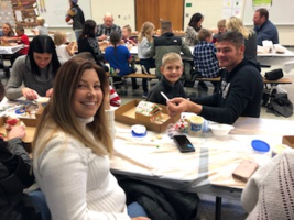 First Graders Build Gingerbread Houses with Families
