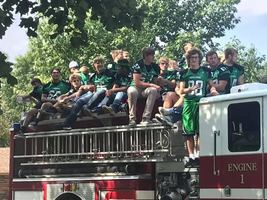 Football players on the fire truck!